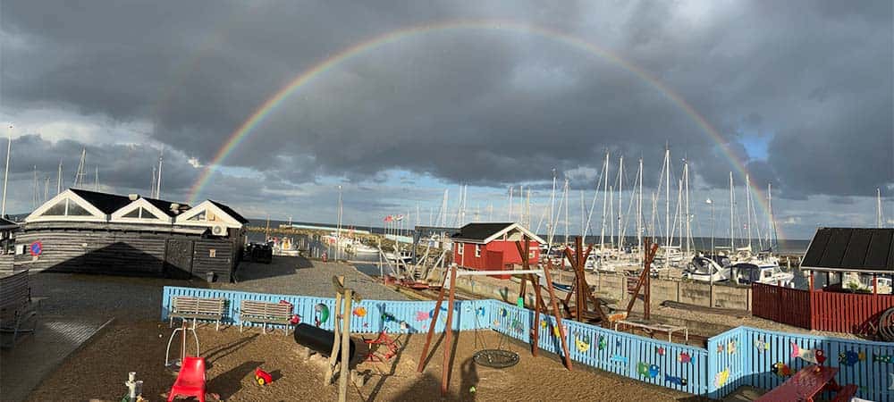 Regnbue over Øster Hurup Havn